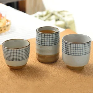 collection of handcrafted chinese ceramic blue checkered tea cups
