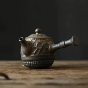 full product view of handcrafted chinese ceramic side handle teapot with built-in strainer