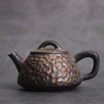 Handcrafted antique style Chinese teapot dark brown with golden speckles side view