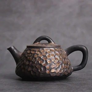 Handcrafted antique style Chinese teapot dark brown with golden speckles side view