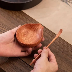 full set of handcrafted natural ebony wood tea scoop and tea chahe on bamboo mat