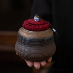 Handcrafted gradient ceramic tea canister full product view with red fabric lid