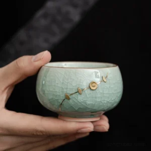 Handcrafted ice crack green ceramic chawan tea bowl with gold floral decoration