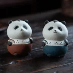handcrafted purple clay cute panda tea pet on wooden tea table