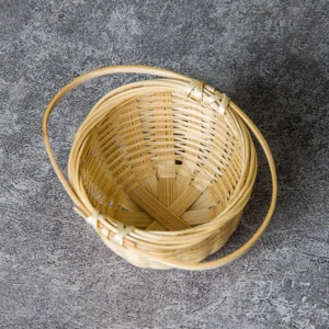 Handmade natural bamboo woven tea strainer on wooden table