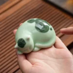 collection of handmade ceramic cat tea pet different styles