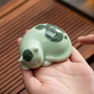 collection of handmade ceramic cat tea pet different styles