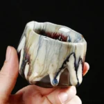 collection of handmade chinese jianzhan tea cups with unique kiln flow glaze patterns