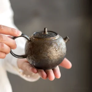 full side view of handmade chinese ceramic teapot