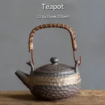 handmade hammered textured chinese teapot with woven handle side view