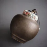 handmade dark ceramic tea canister with fabric drawstring lid loose leaf tea storage