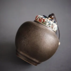 handmade dark ceramic tea canister with fabric drawstring lid loose leaf tea storage