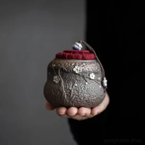 handmade 3d embossed plum blossom ceramic tea canister front view