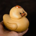 front view of handmade purple clay cute duck tea pet gongfu tea ceremony decor