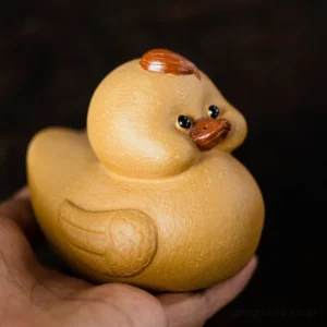 front view of handmade purple clay cute duck tea pet gongfu tea ceremony decor