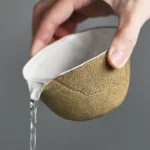 pouring test of handmade textile burnt ceramic gong dao bei tea pitcher