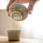 Ice Ash Glaze Ceramic Tea Strainer with Stainless Steel Tea Filter on display