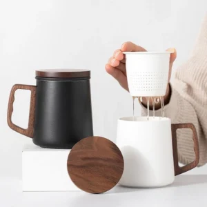 large ceramic tea mug with wooden handle and infuser overall view