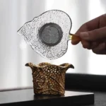leaf-shaped glass tea strainer with gold plated stand fine mesh tea filter