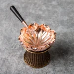 lotus shaped brass tea strainer with matching holder full view