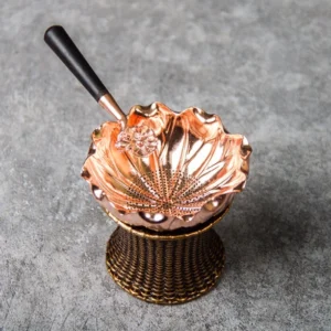 lotus shaped brass tea strainer with matching holder full view