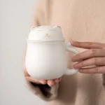 matte black ceramic tea mug with cat lid and stainless steel infuser main view