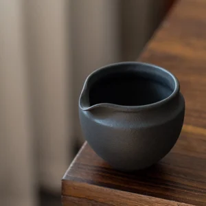 minimalist matte black volcanic rock clay gong dao bei tea fair pitcher