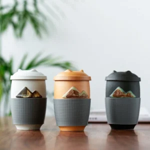 mountain embossed ceramic tea mug with infuser, black color variant