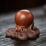 Handcarved zisha clay octopus tea pet on wooden tea tray