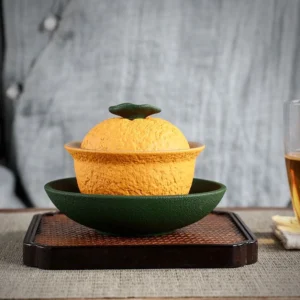 full view of handcrafted orange shape ceramic gaiwan chinese tea vessel