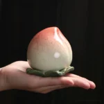 handcrafted ceramic peach shape tea canister sealed tea storage jar main view