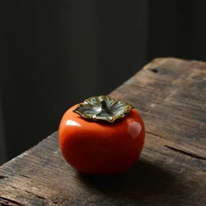 persimmon shaped ceramic tea canister front view