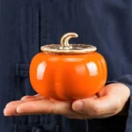 handmade persimmon shaped ceramic tea canister front view