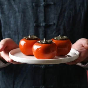 Handcrafted persimmon shaped ceramic tea canister whole product view