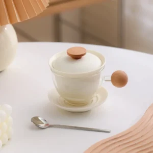 pink glass tea mug with ceramic infuser and wooden handle product view
