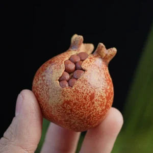 Handcrafted lifelike purple clay pomegranate tea pet main view