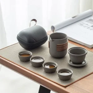 Full set view of portable ceramic travel tea set with black waterproof carrying case