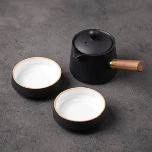 full view of 6.4oz portable ceramic travel tea set with detachable wooden handle and 2 teacups