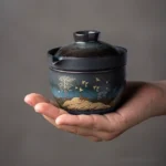 Full set view of portable hand-painted ceramic travel tea set with gaiwan teacup and protective carry bag