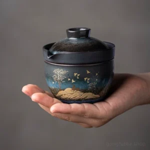 Full set view of portable hand-painted ceramic travel tea set with gaiwan teacup and protective carry bag
