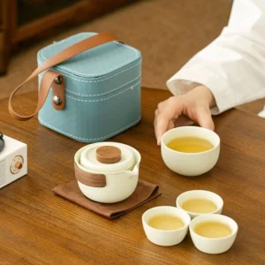 Full portable porcelain travel tea set with carry case open showing teapot and cups