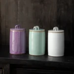 full side view of purple textured elephant handle airtight ceramic tea canister