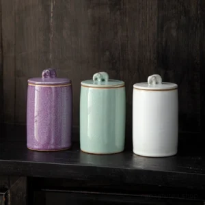 full side view of purple textured elephant handle airtight ceramic tea canister