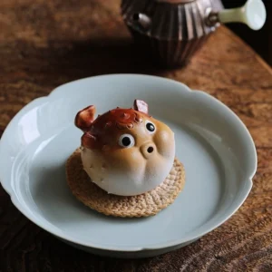handmade purple clay pufferfish tea pet cute blowfish tea table decor front view
