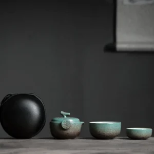 full nested set of retro blue green ceramic travel tea set in black carrying bag