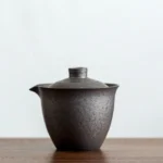 rustic dark ceramic gaiwan with built-in infuser gong dao bei pitcher front view