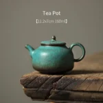 side view of handcrafted blue green speckled chinese gongfu teapot