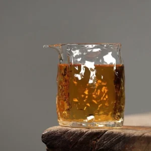 Side view of handcrafted square hammered texture glass gong dao bei fairness cup