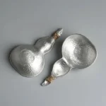 hand hammered tin gourd tea strainer spoon with twine wrapped handle