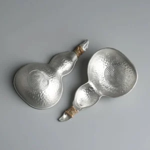 hand hammered tin gourd tea strainer spoon with twine wrapped handle